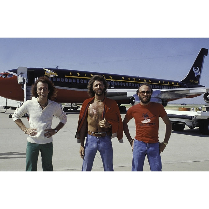 the Bee Gees in front of an airplane Photo Print Image 1