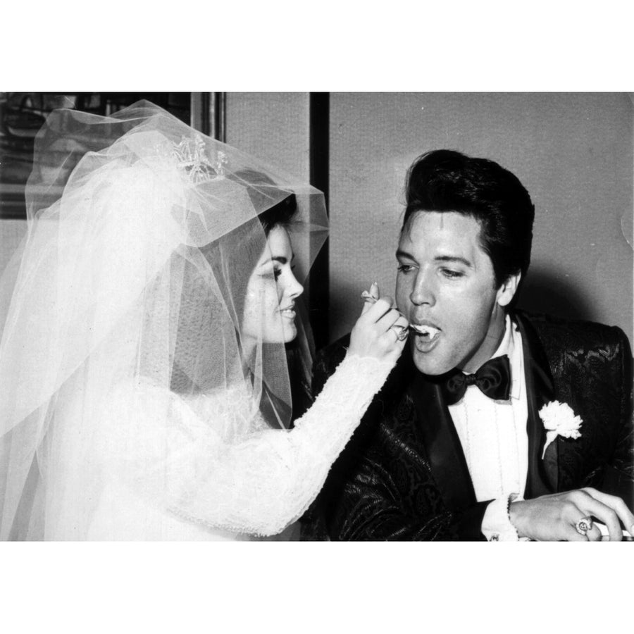 Priscilla feeding Elvis Presley cake at their wedding Photo Print Image 1