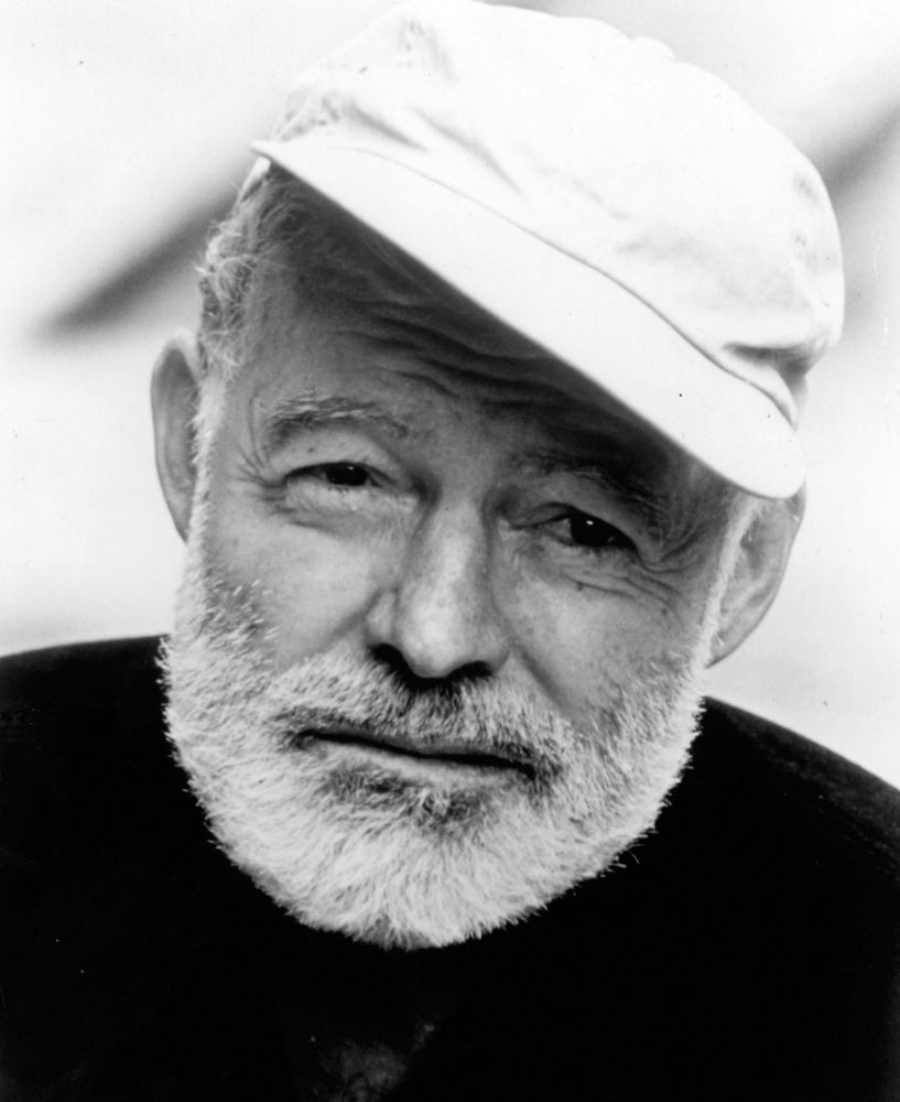 Ernest Hemingway wearing a baseball cap Photo Print Image 1