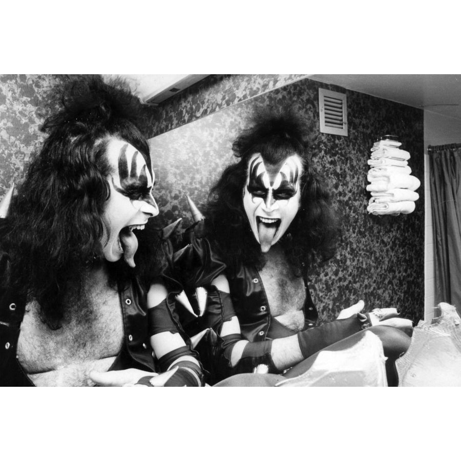 Gene Simmons sticking out his tongue by a bathroom mirror Photo Print Image 1