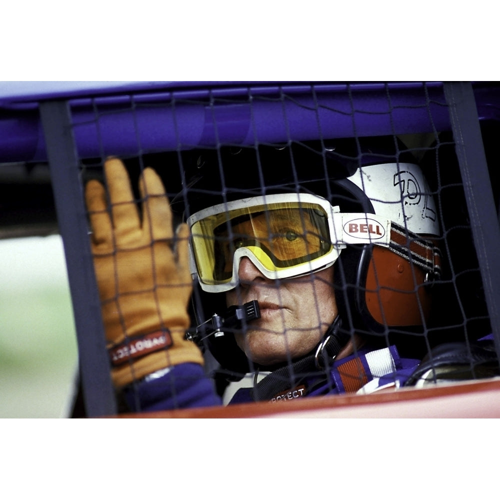 Paul Newman wearing a helmet and goggles in a racing car Photo Print Image 1