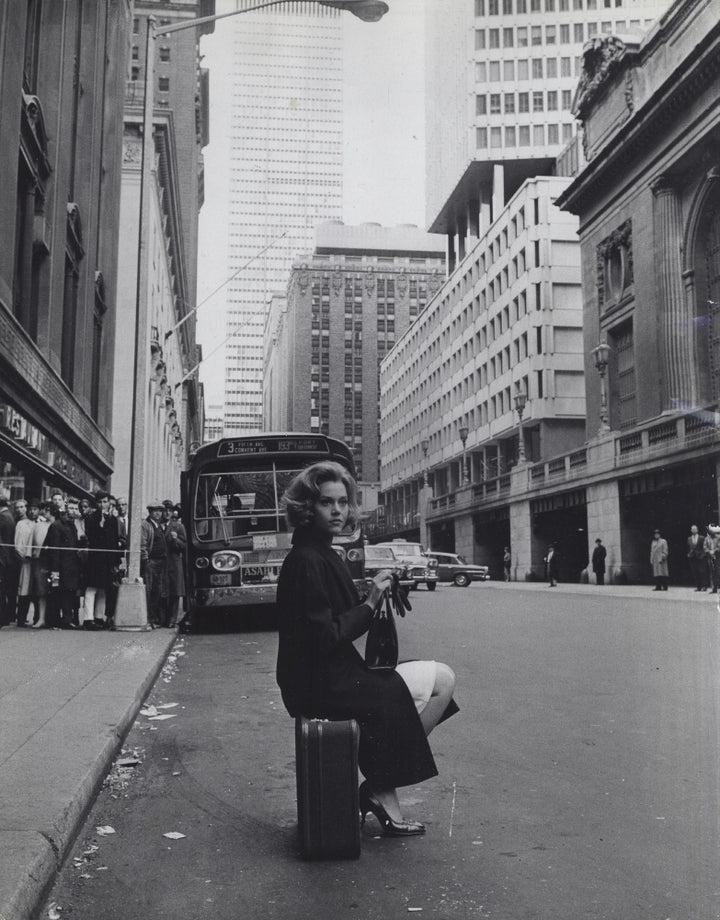 Jane Fonda sitting on a suitcase on a city street Photo Print Image 2