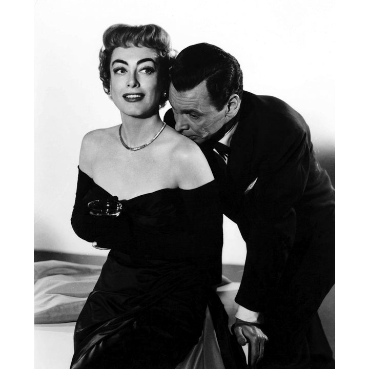 Joan Crawford with an actor kissing her shoulder Photo Print Image 1