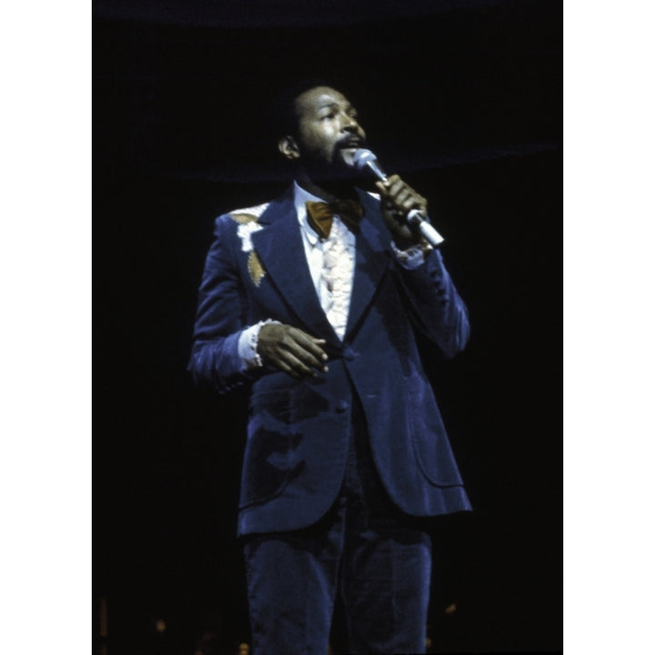 Marvin Gaye performing on stage wearing a blue suit Photo Print Image 1