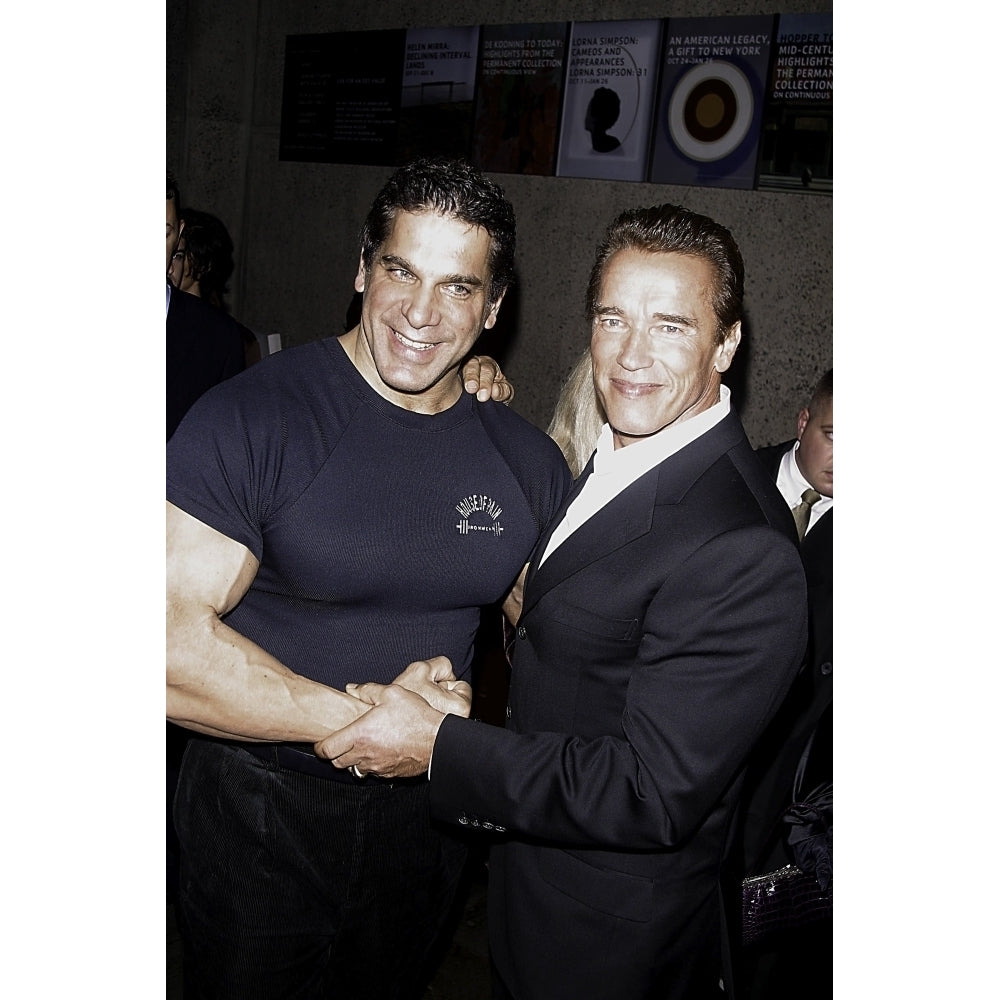 Arnold Schwarzenegger and Lou Ferrigno shaking hands at the 25th Anniversary of Pumping Iron event Photo Print Image 1