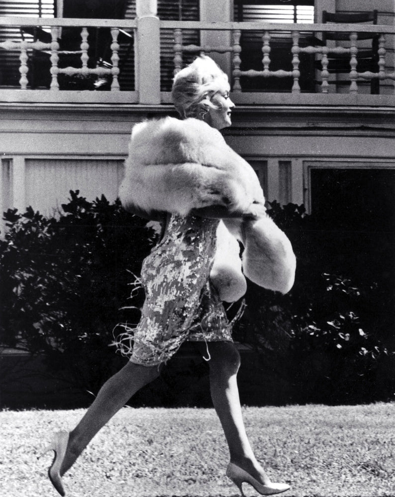 Marilyn Monroe walking across a lawn Photo Print Image 1