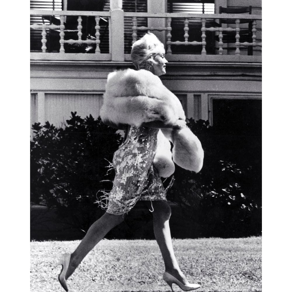 Marilyn Monroe walking across a lawn Photo Print Image 1