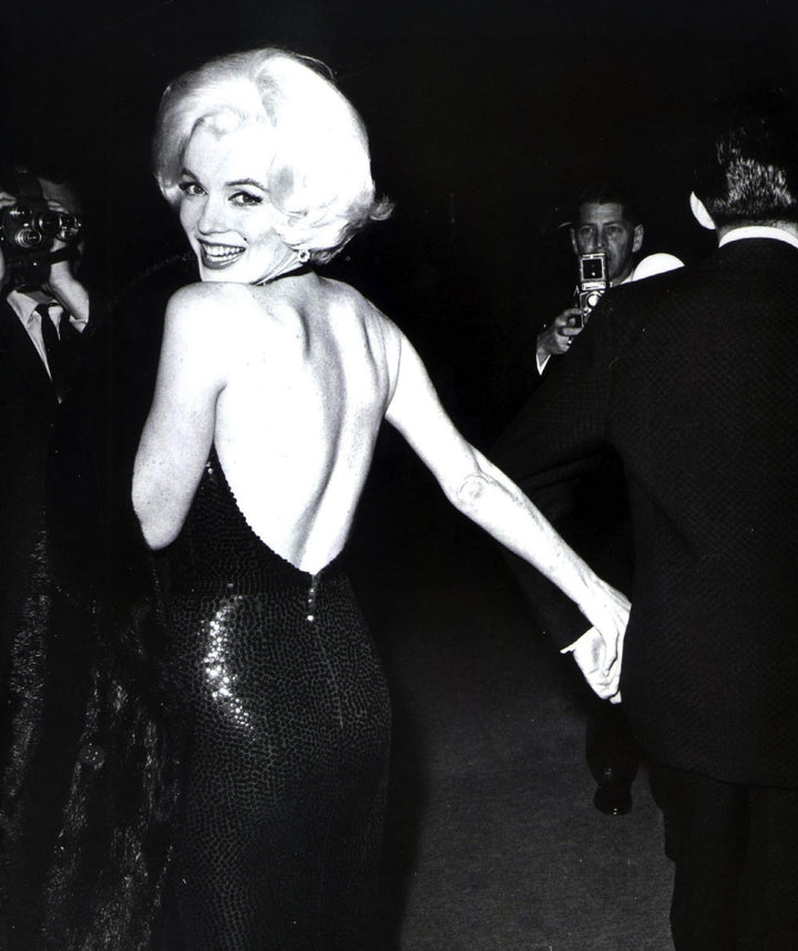 Marilyn Monroe looking over her shoulder wearing an evening dress Photo Print Image 1