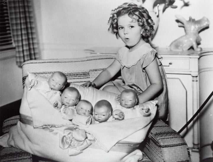 Shirley Temple playing with baby dolls Photo Print Image 1