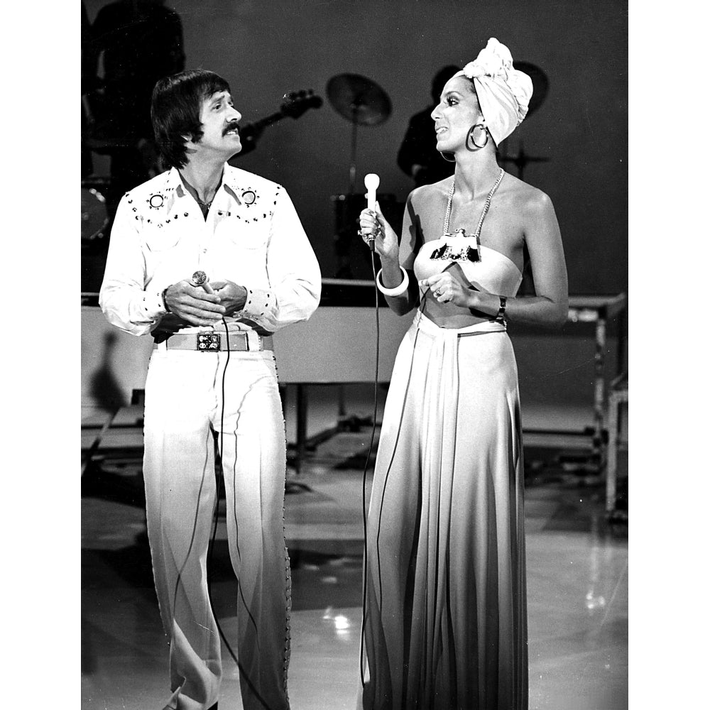 Cher wearing a headscarf and Sonny performing on stage Photo Print Image 1