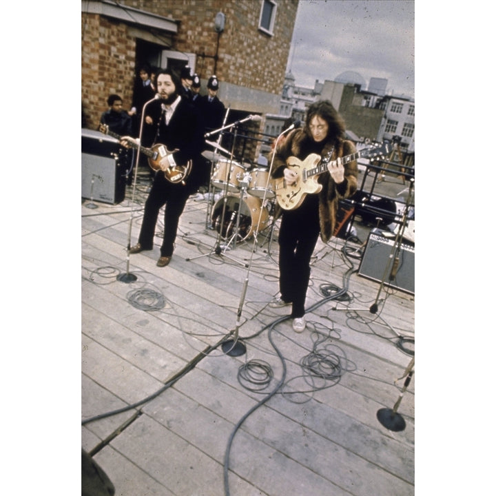 The Beatles performing on a rooftop Photo Print Image 2