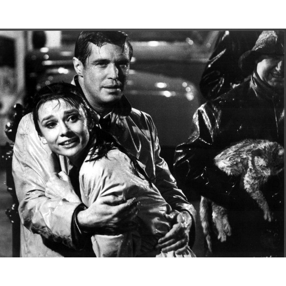 Audrey Hepburn And George Peppard In The Rain For Breakfast At TiffanyS Photo Print - Item MVM02971 Image 1