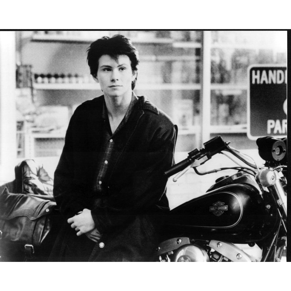 Christian Slater Leaning On Motorcycle In Heathers Photo Print - Item MVM03240 Image 1