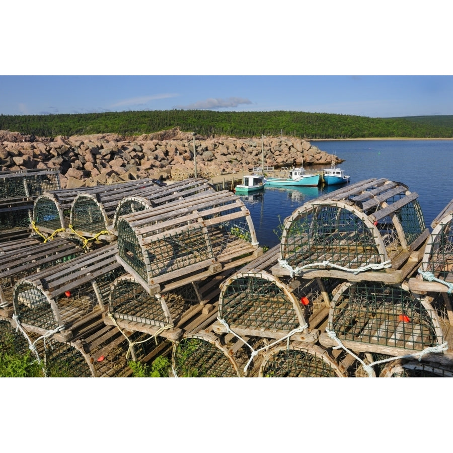 Canada Nova Scotia Neils Harbour. Boats and lobster traps in coastal village. Poster Print by Jaynes Gallery Image 1