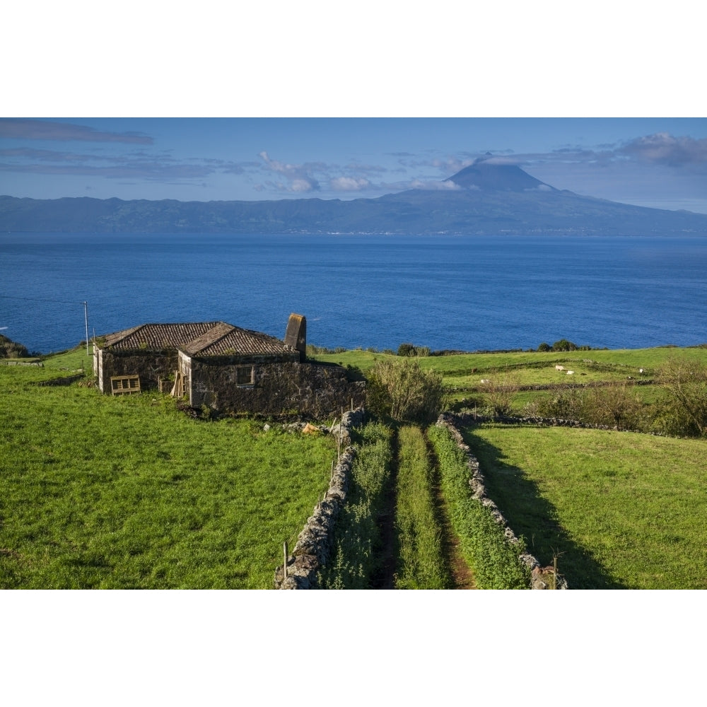 Portugal Azores Sao Jorge Island Rosais. Elevated view of fields and the Pico Volcano Poster Print by Walter Bibikow Image 1