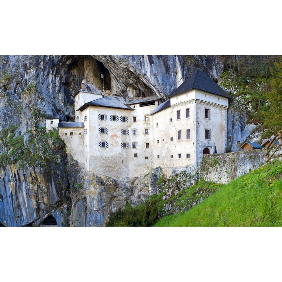 Slovenia Predjama Castle. Castle built into mountain wall. Poster Print by Jaynes Gallery Image 1