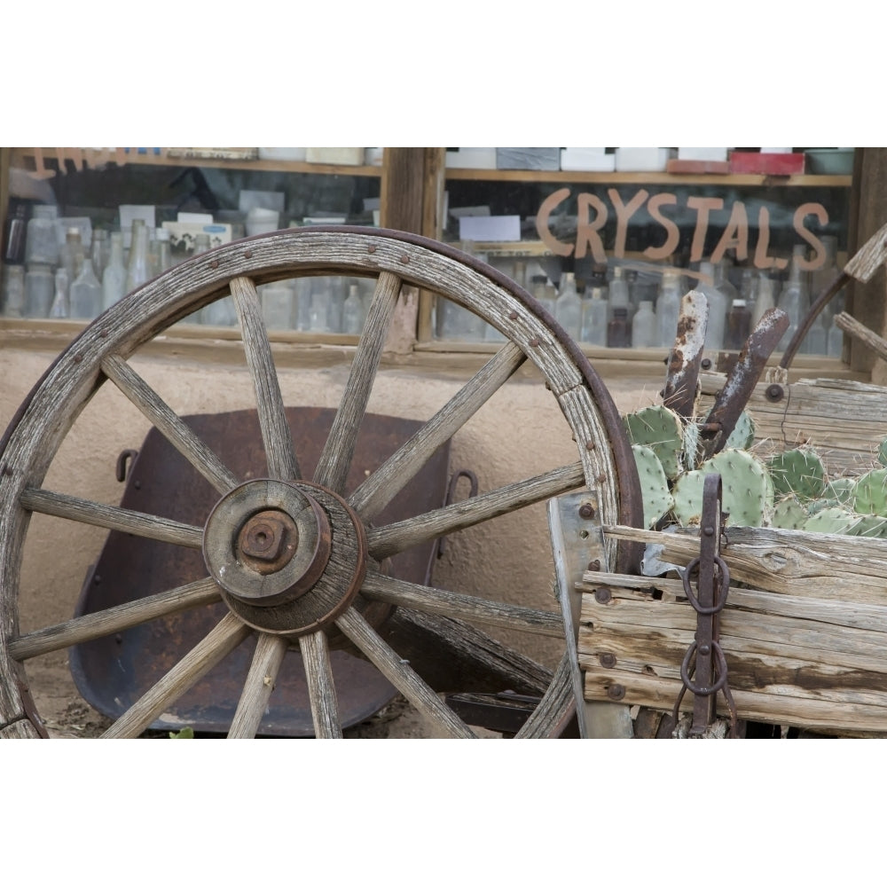 Turquoise Trail Scenic Byway Mexico. An old wagon wheel Poster Print by Deborah Winchester Image 1