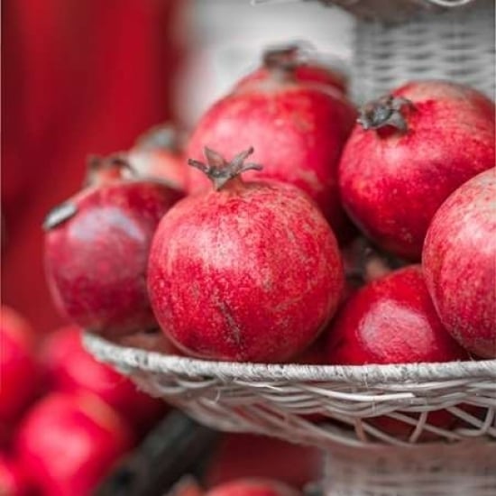 Pomegranates in basket Poster Print by Assaf Frank Image 1