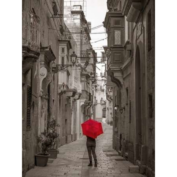 Tourist with umbrella at narrow street on Birgu Malta Poster Print by Assaf Frank Image 1