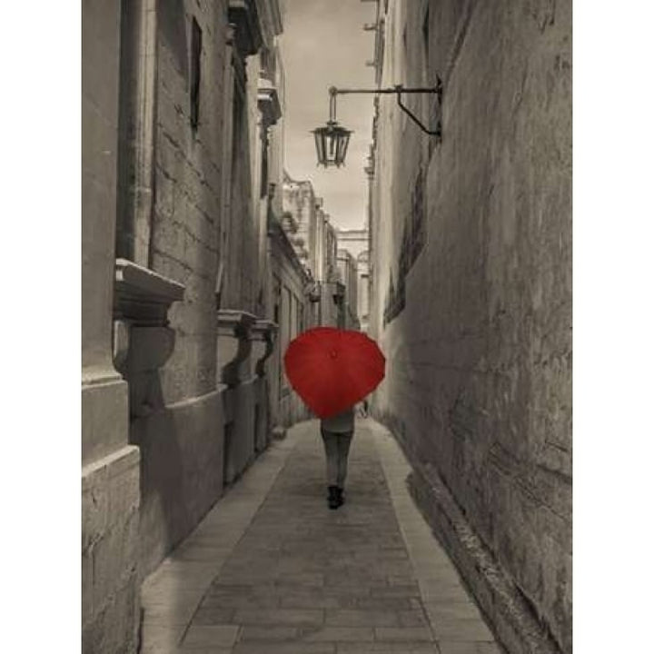 Tourist with heart shaped umbrella walking through narrow street of Mdina Malta Poster Print by Assaf Frank Image 1