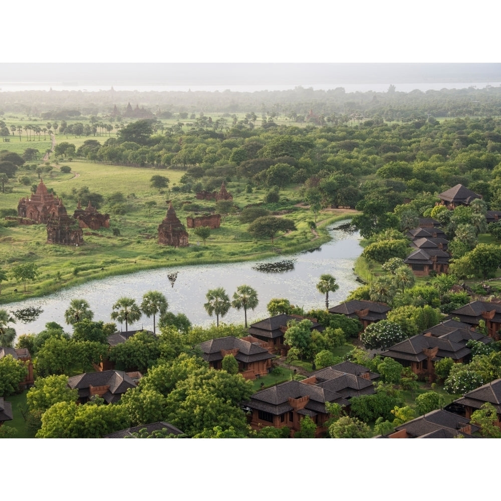 Villas at Aureum Palace Hotel and nearby stupas in the Bagan plain Mandalay Region Myanmar Print by Panoramic Images Image 1