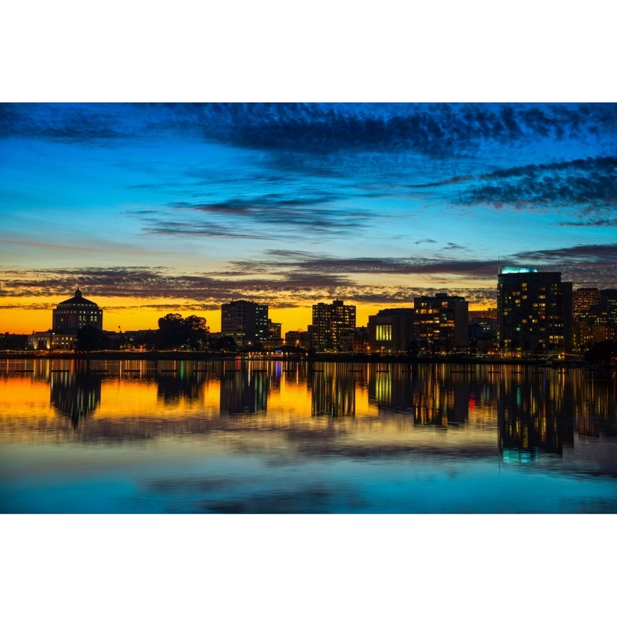 Reflection of buildings on water Lake Merritt Oakland California USA Poster Print by Panoramic Images Image 1