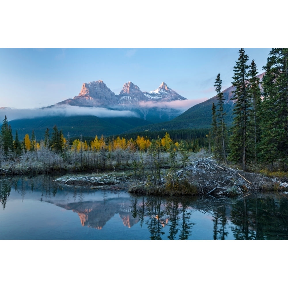 Lake with mountains in background Beaverlodge Three Sisters Canmore Alberta Canada Poster Print Image 1