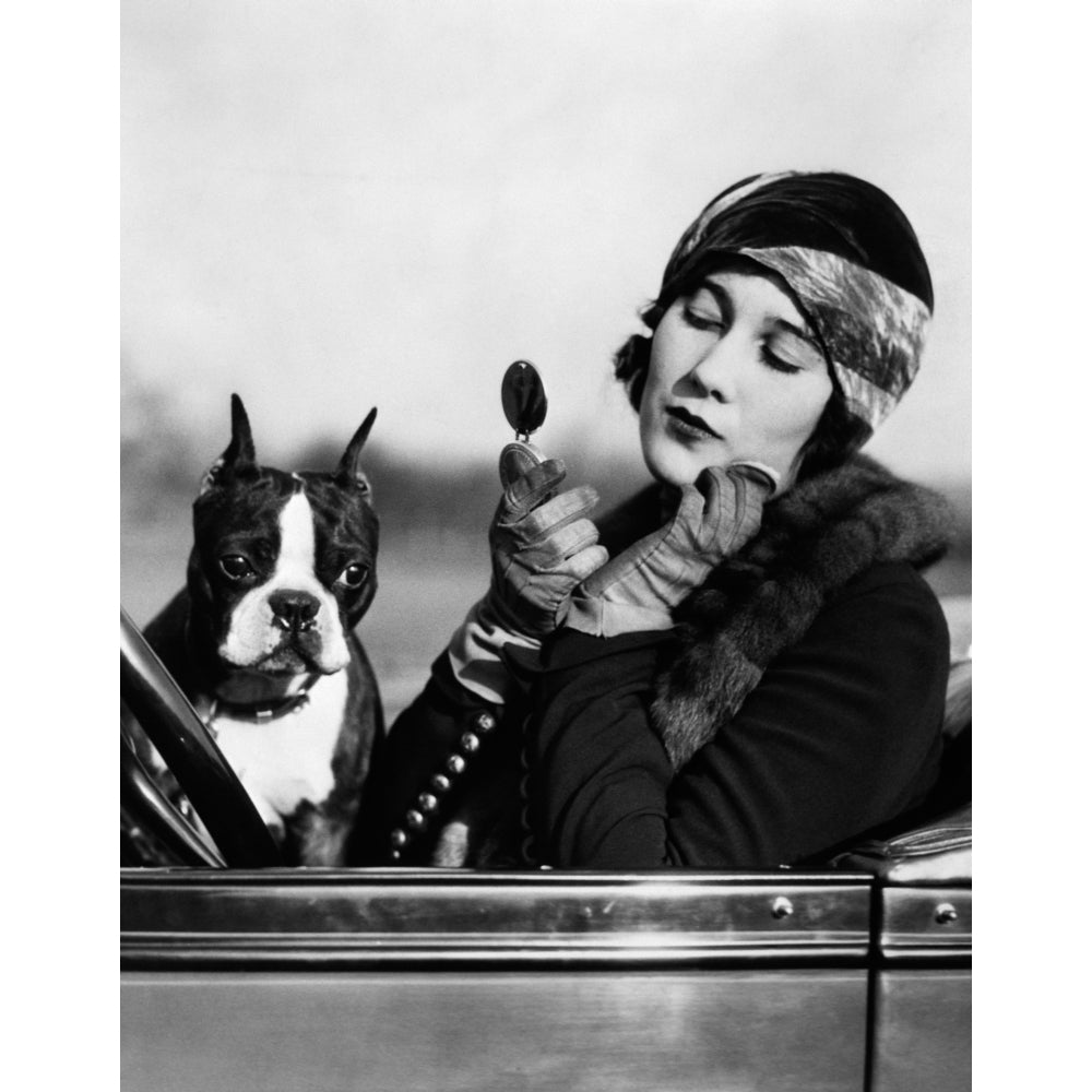 1920s Flapper In Convertible Powdering Her Cheek In Mirror With Boston Bulldog In Her Lap Print By Vintage Collection Image 1