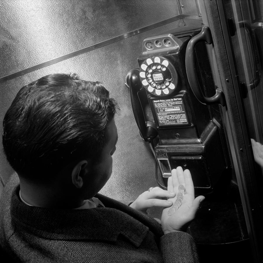 1940s-1950s Man Counting Change In Hand In Public Telephone Booth Poster Print By Vintage Collection Image 1