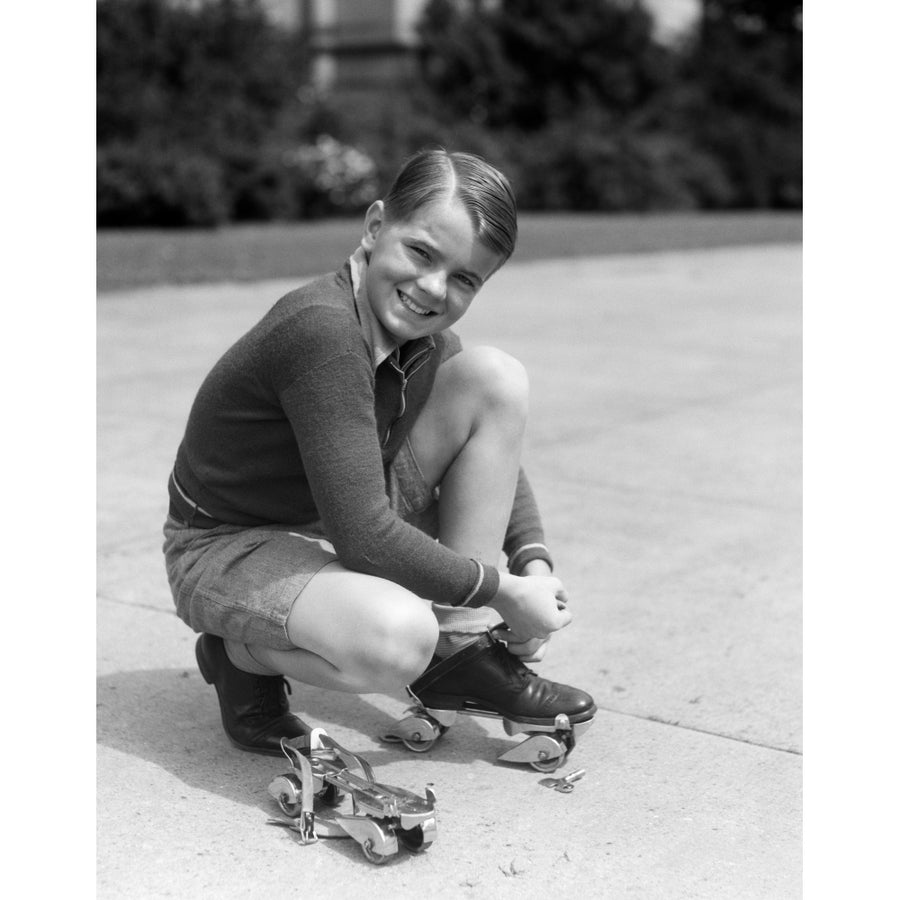 1930s Smiling Boy Fastening On Streamline Metal Roller Skates Poster Print By Vintage Collection Image 1