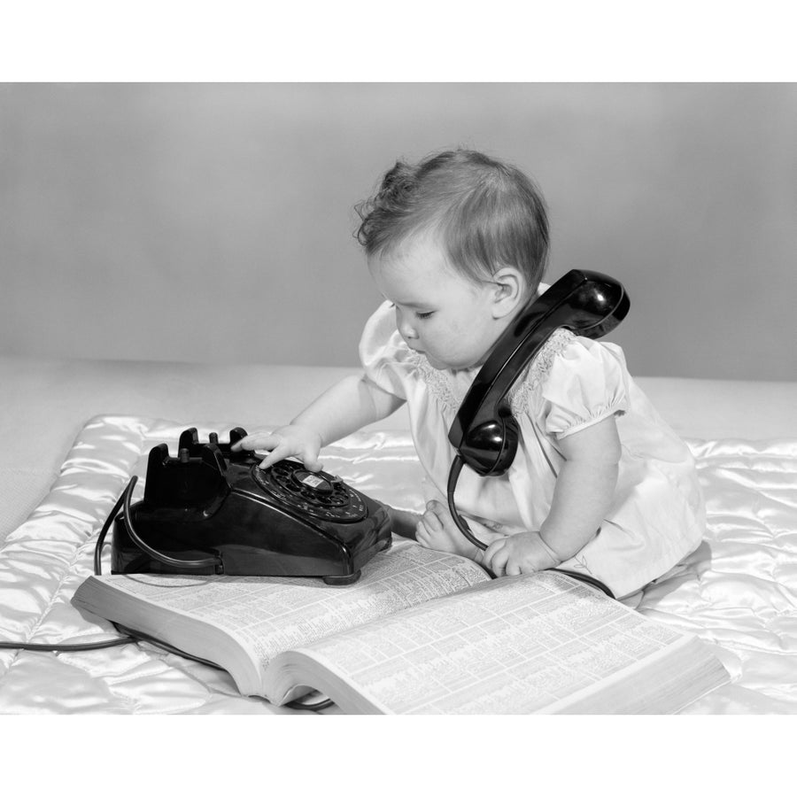 1960s Baby Girl With Telephone Book Dialing Rotary Telephone Poster Print By Vintage Collection Image 1