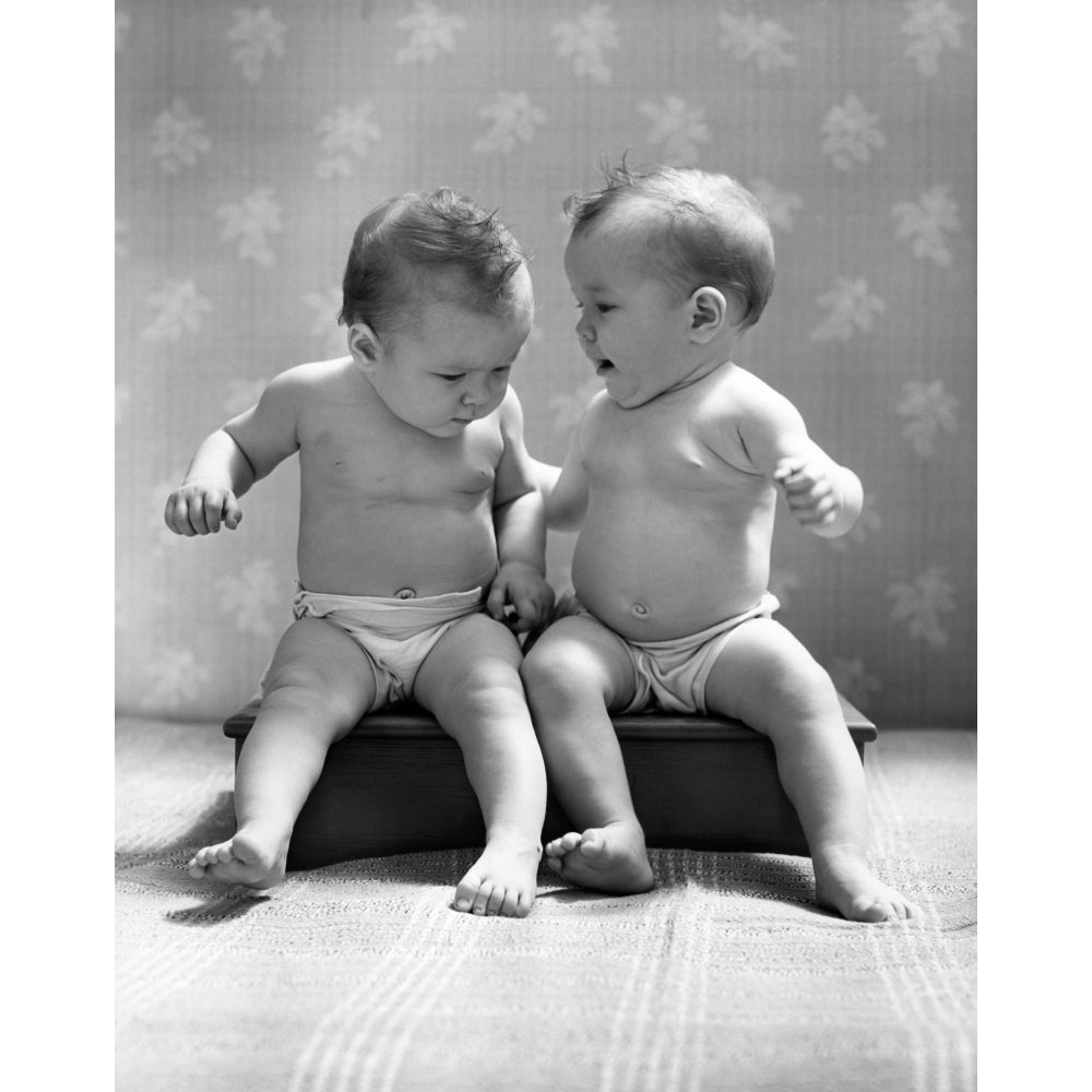 1930s-1940s Twin Babies Wearing Diapers Together Sitting On A Bench Side By Side Studio Print By Vintage Collection Image 1