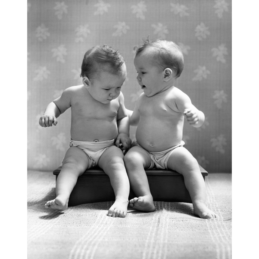 1930s-1940s Twin Babies Wearing Diapers Together Sitting On A Bench Side By Side Studio Print By Vintage Collection Image 1