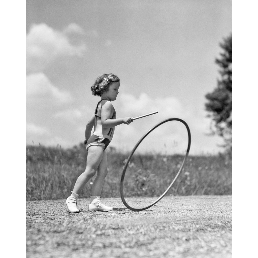 1930s Girl Outdoors Rolling A Hoop Playing Hoop And Stick Game Poster Print By Vintage Collection Image 1