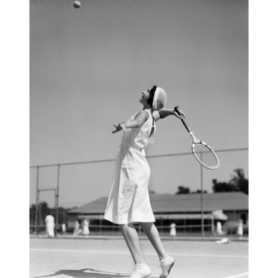 1930s Woman Playing Tennis About To Hit Ball With Racket Poster Print By Vintage Collection Image 1