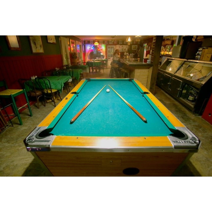 Pool table lit by electric lights in a restaurant and bar in Shoshone CA near Death Valley National Park Print by Image 1