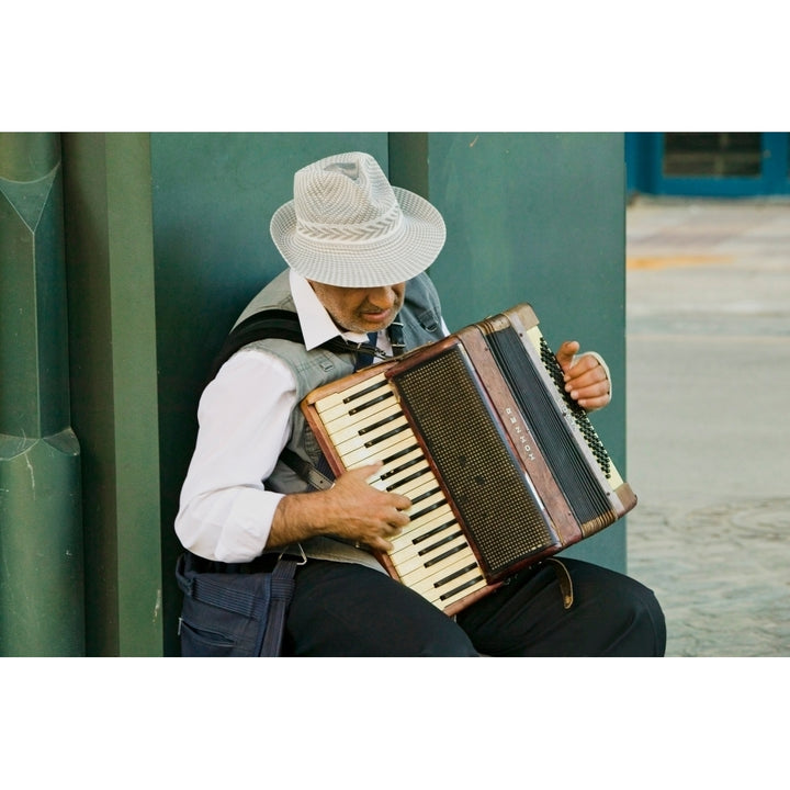 Male accordion player in town center of Sevilla Andalucia Southern Spain Poster Print by Panoramic Images Image 1