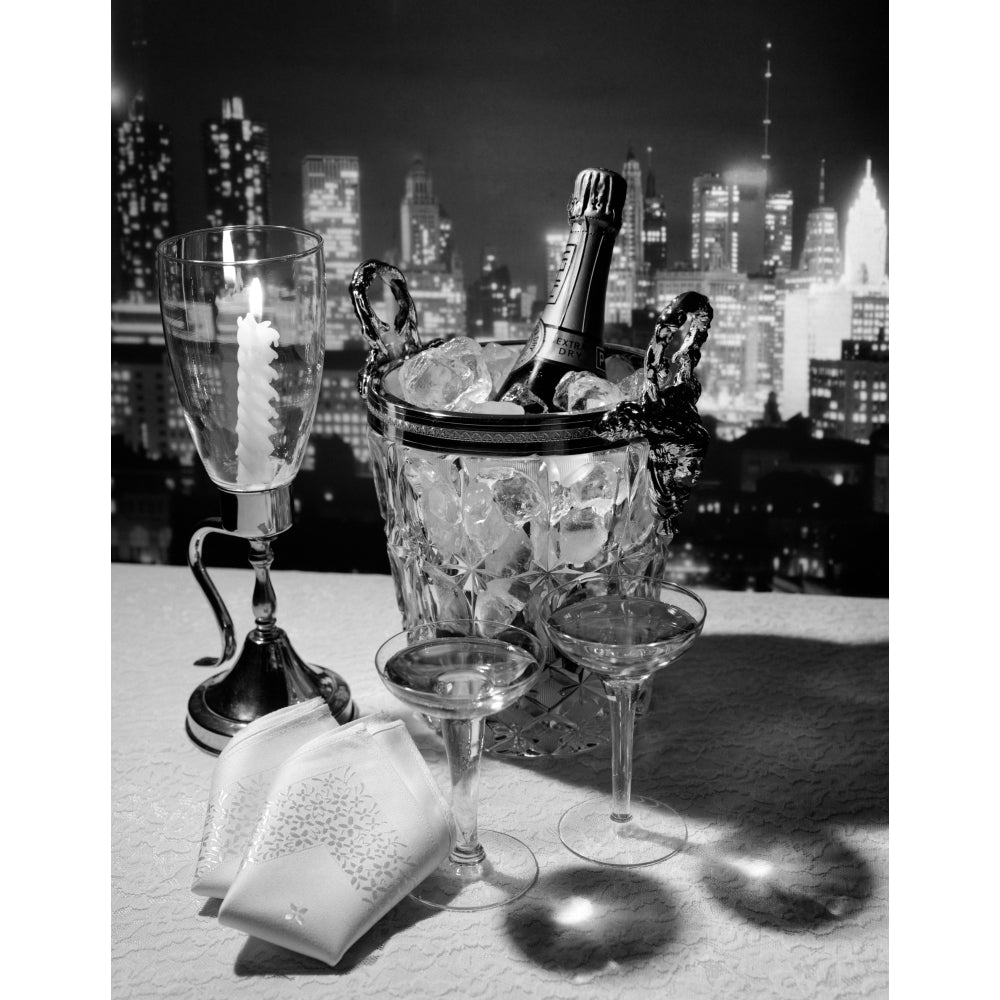 1970s Champagne Bottle In Ice Bucket With Glasses Candle and Napkins On Table and York City Night Skyline In Background Image 1