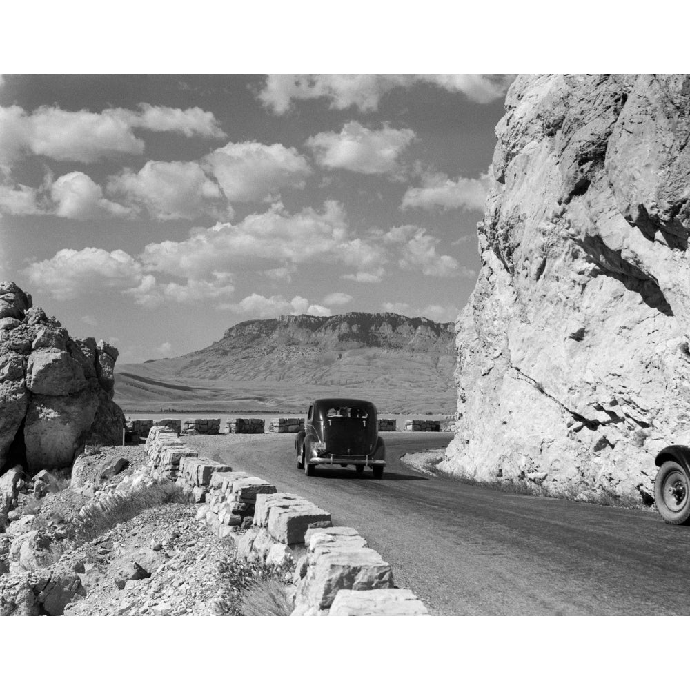 1930s-1940s Car Driving On Mountain Road In Yellowstone National Park Near Cody Wyoming Usa Print By Vintage Collection Image 1