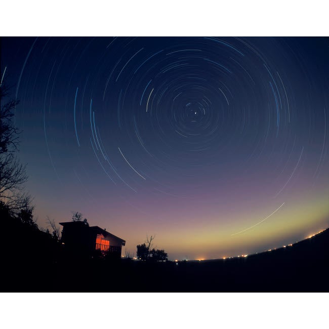 Circumpolar star trails with a faint aurora over horizon Alberta Canada Poster Print by Alan Dyer/Stocktrek Images Image 1