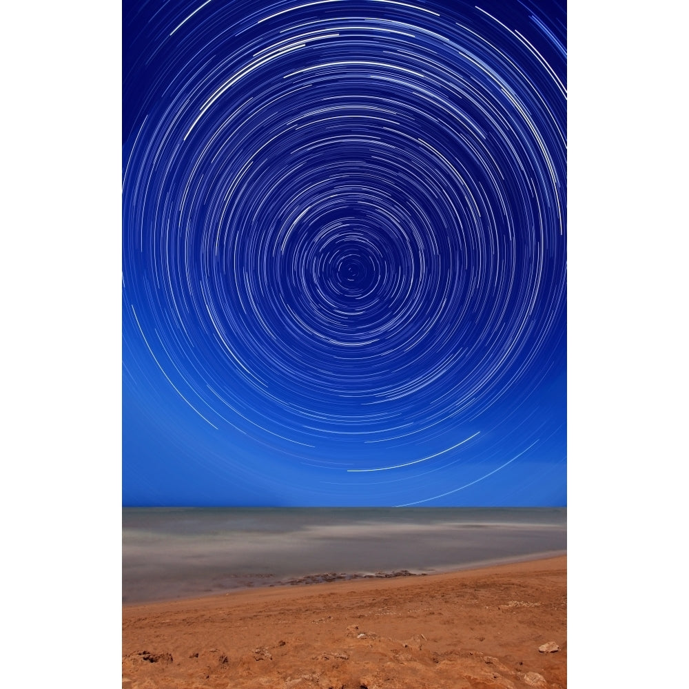 Star trails around the south celestial pole at the beach in Miramar Argentina Poster Print Image 2