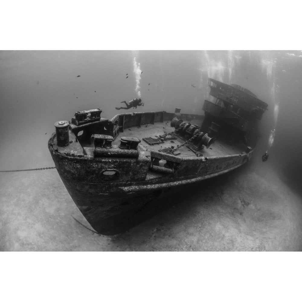 Divers explore the Kittiwake wreck in Grand Cayman Cayman Islands Poster Print by Brook Peterson/Stocktrek Images Image 1