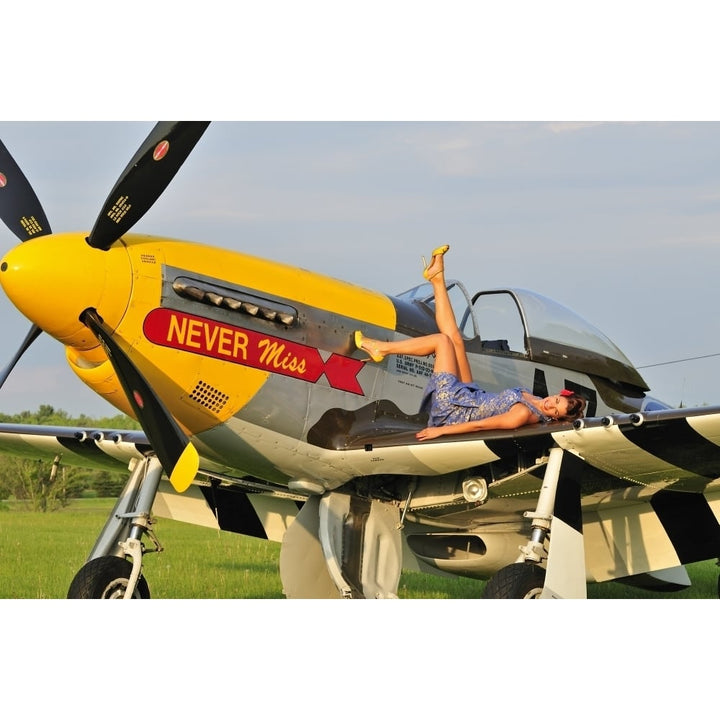 1940s style pin-up girl lying on the wing of a P-51 Mustang Poster Print Image 1