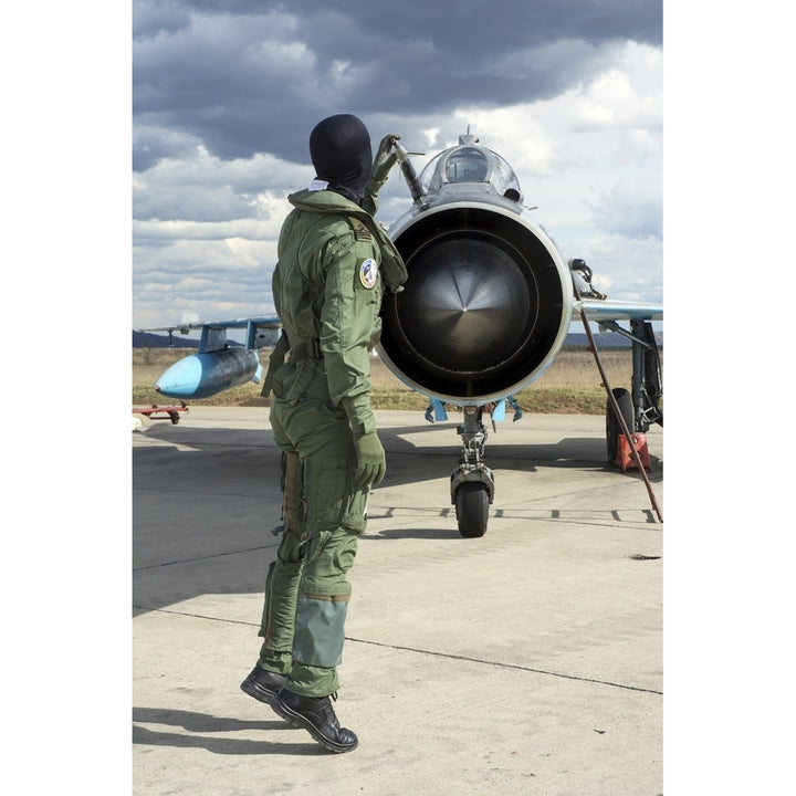 Romanian Air Force pilot checking his MiG-21 Lancer Poster Print Image 1