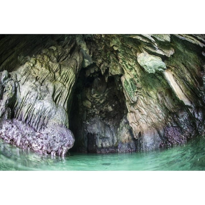 A cave has formed inside a limestone island in Raja Ampat Poster Print Image 1