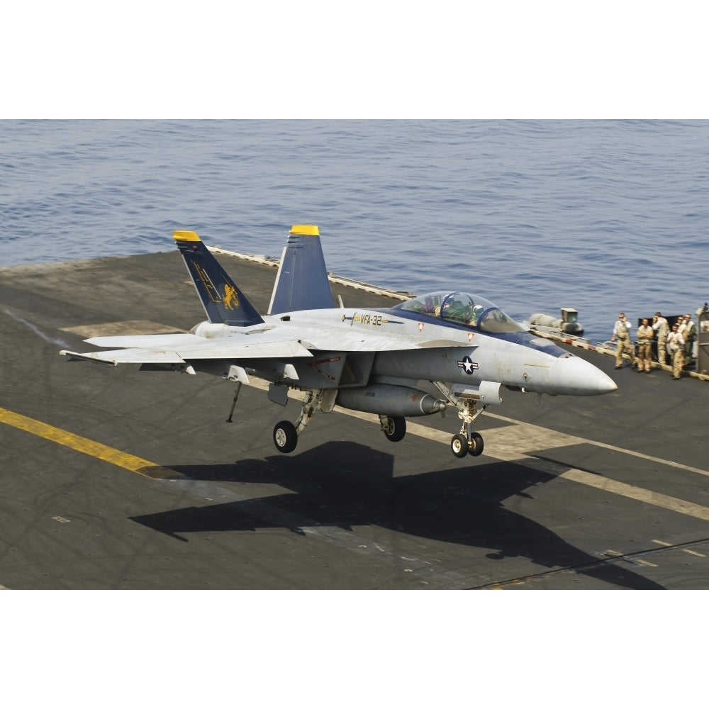 An F/A-18E Super Hornet trap landing on the flight deck of USS Harry S. Truman Poster Print Image 1