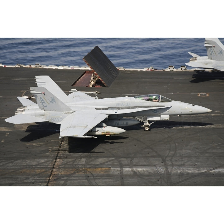 An F/A-18C Hornet sits ready on the flight deck of USS Harry S. Truman Poster Print Image 2