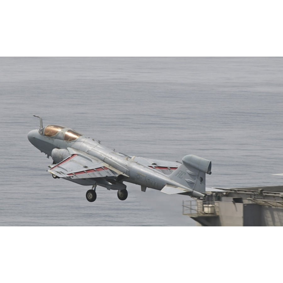 An EA-6B Prowler lifts off from the flight deck of USS Harry S. Truman Poster Print Image 1