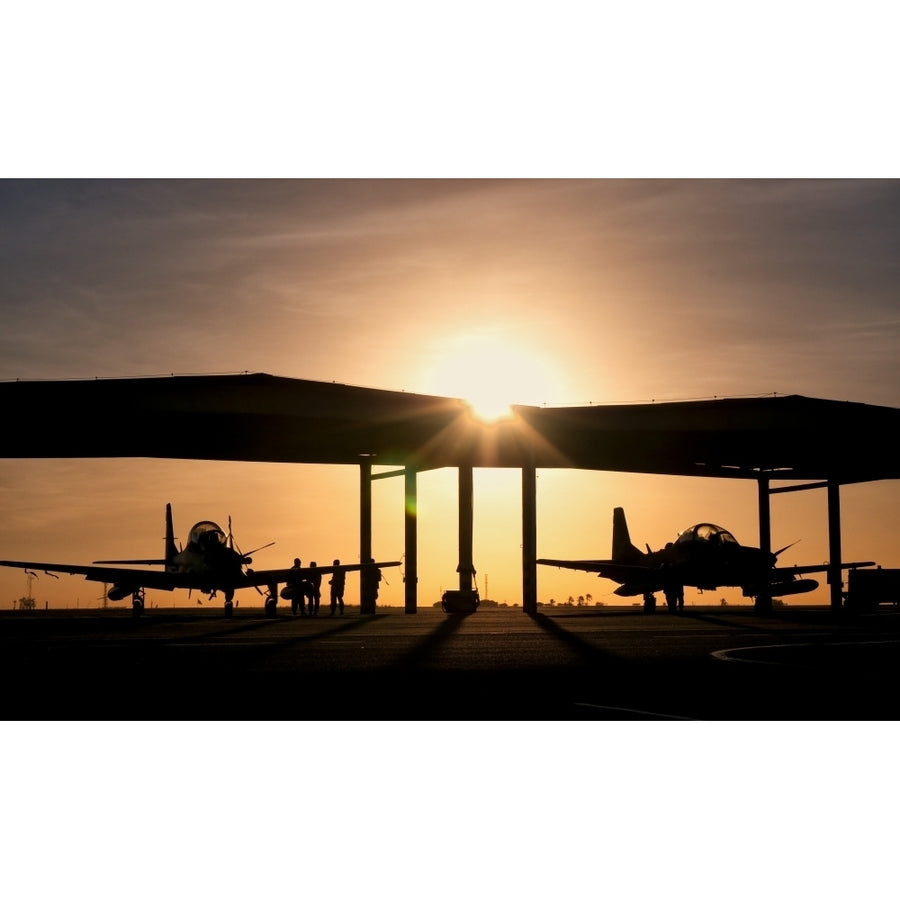 Two Embraer A-29 Super Tucano aircraft parked in the hangar at Natal Air Force Base Brazil Poster Print Image 1