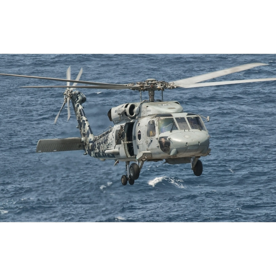 A US Navy SH-60F Seahawk flying off the coast of Pakistan Poster Print Image 1